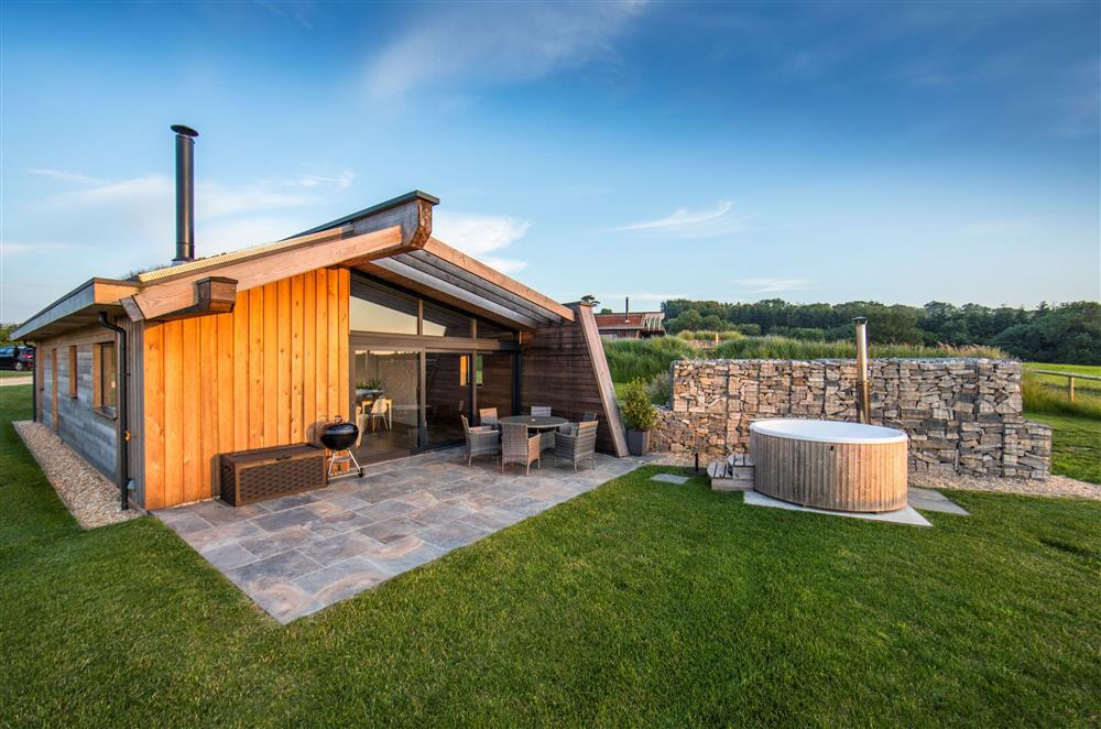 The private terrace at Bramble features a Skarsgard Swedish, wood fired hot tub  at Dorset Eco Retreats, Ansty, Dorchester