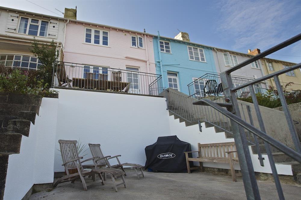 Terrace with wooden table, benches and sunloungers (photo 3) at Dory Cottage in , Salcombe