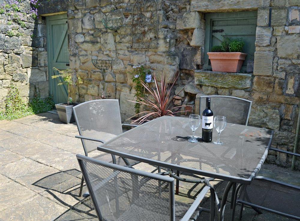 Enclosed patio with garden furniture at Dots House in Alnwick, Northumberland