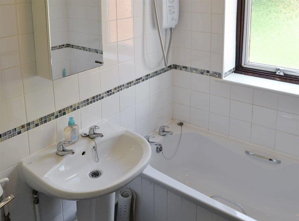 Family bathroom with shower over bath at Dots Place in North Walsham, Norfolk