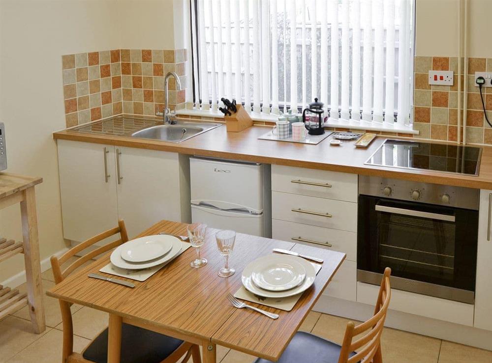 Fully appointed kitchen with dining area at Dots Place in North Walsham, Norfolk