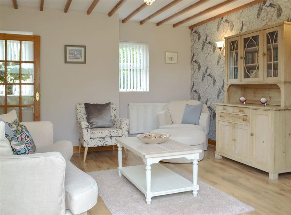 Comfortable living room at Dove Cottage in Pontyates, near Kidwelly, Dyfed