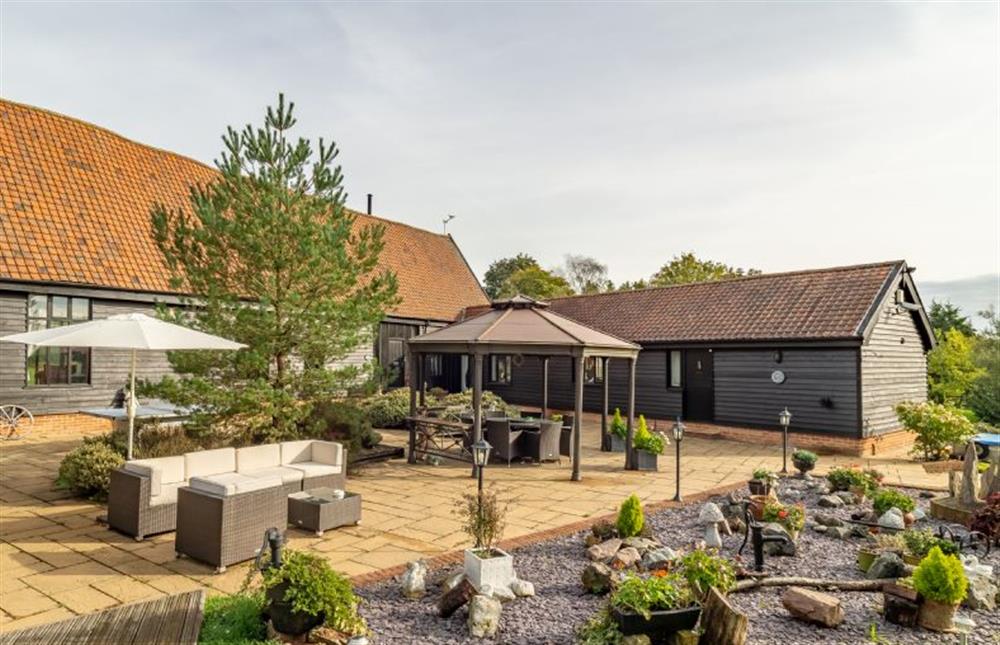 The courtyard with garden furniture and table tennis  at Doves Barn, Needham Market