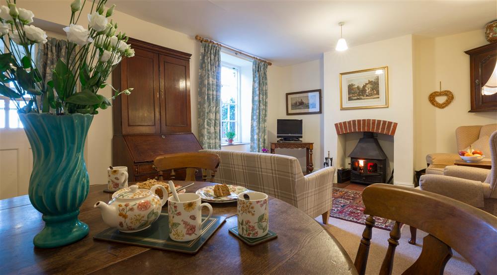 The sitting and dining room at Downhouse Farm Cottage in Bridport, Dorset