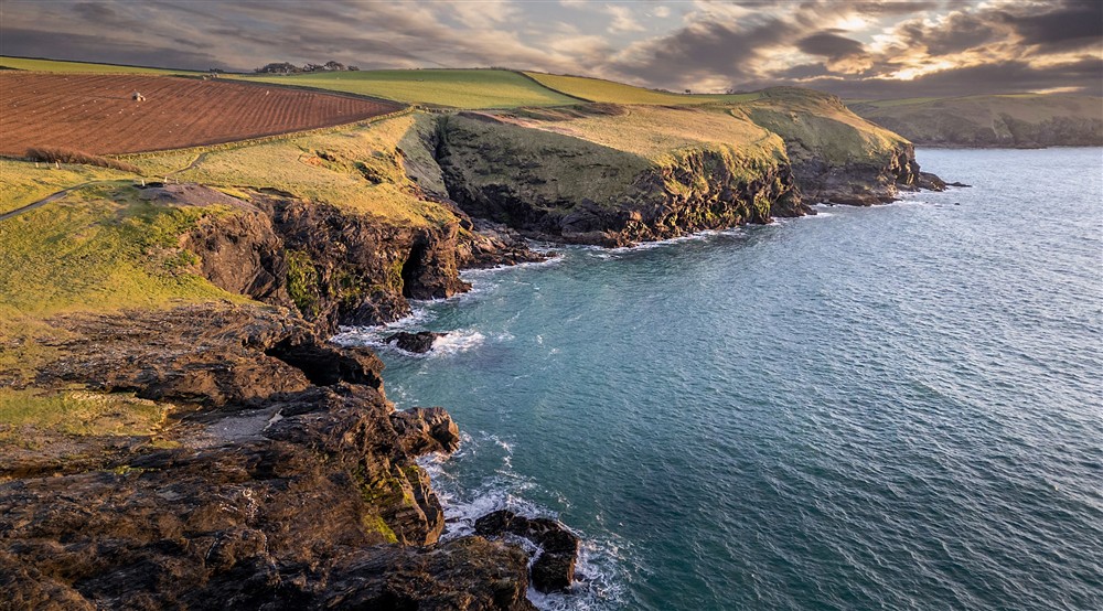 A view of the coastal cliffs near Doyden Castle, Cornwall at Doyden Castle in Port Quin, Cornwall