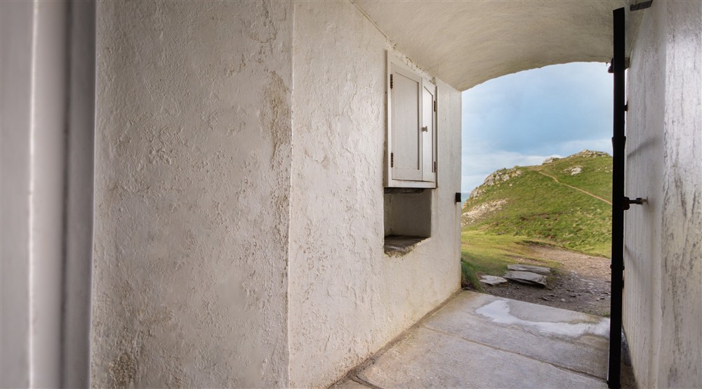 The entrance to Doyden Castle is through a private tunnel, Cornwall at Doyden Castle in Port Quin, Cornwall