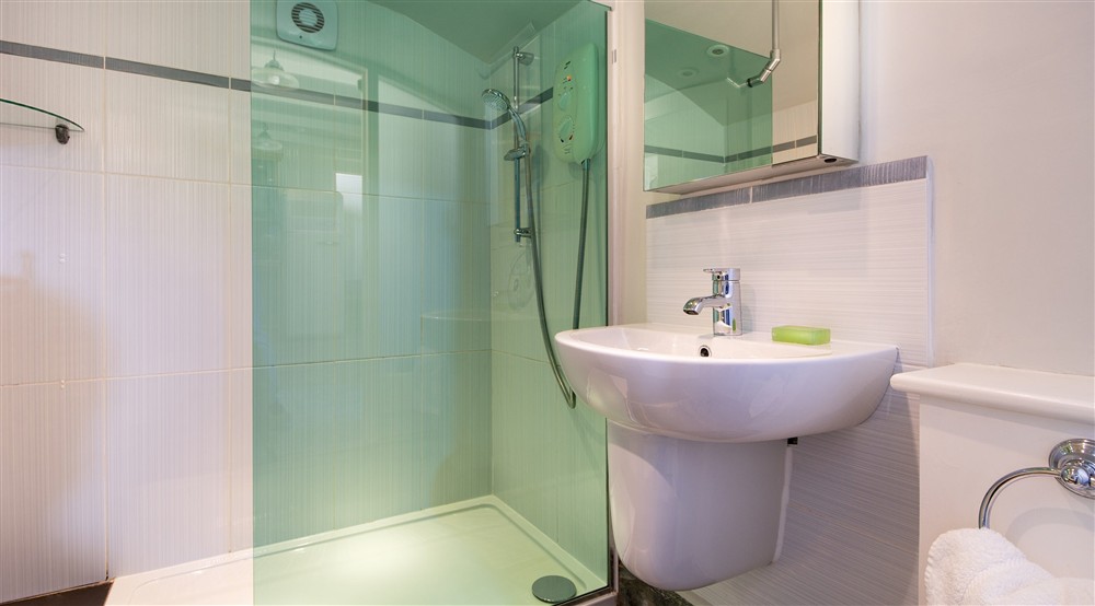 The shower room at Doyden Castle in Port Quin, Cornwall