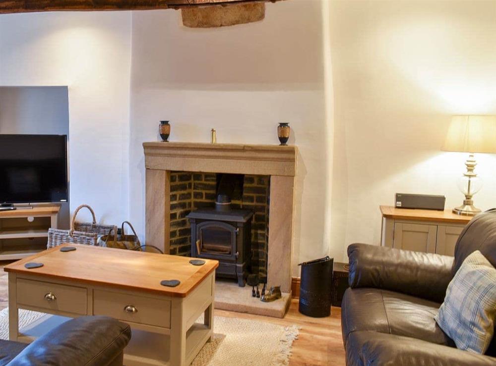 Relax in the living area at Dragon Cottage in Brassington, Derbyshire