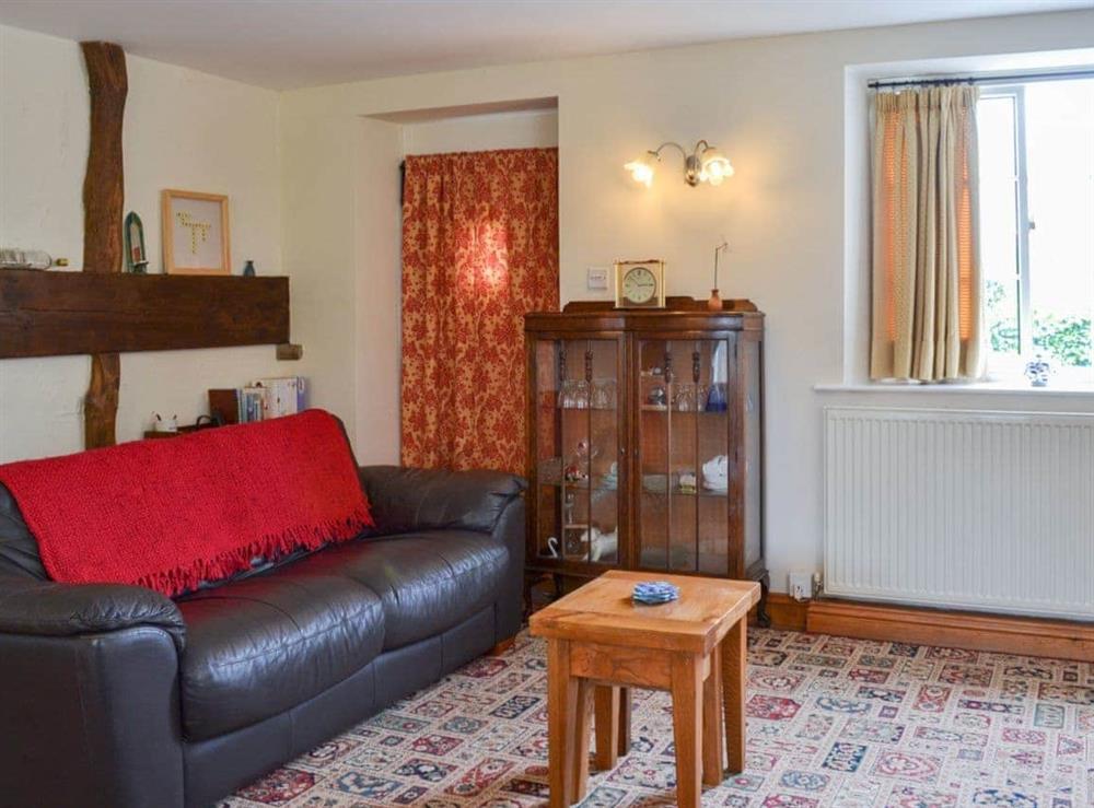 Cosy and comfortable living/dining area at Dragonfly Cottage in Brompton by Sawdon, North Yorkshire