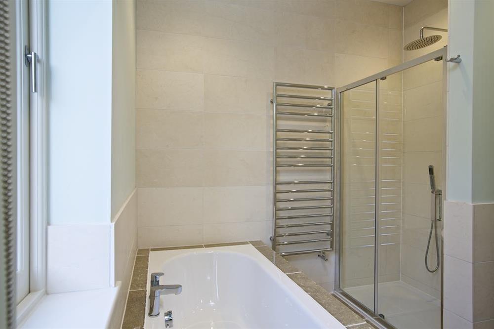 Stunning en suite bathroom with bath and walk-in shower at Drake House in , Hope Cove