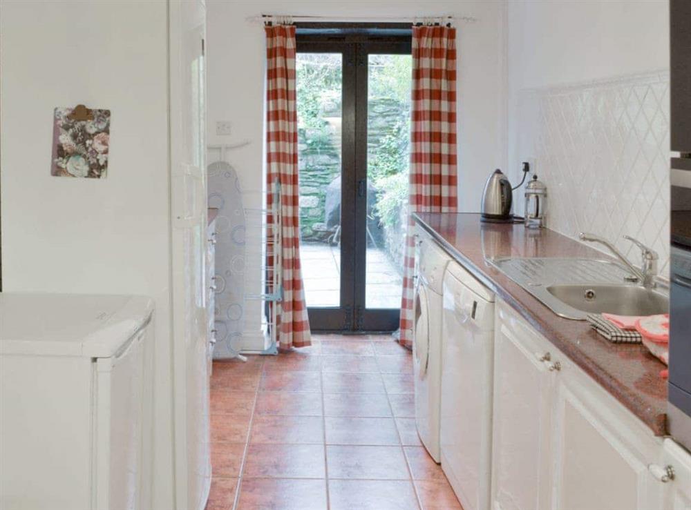 Kitchen with French doors to patio area at Dray Cottage in East Allington, Nr. Totnes, Devon., Great Britain