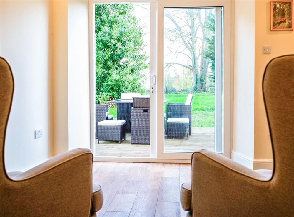 Sun room with view to the garden at Driby Manor House in Driby Top, near Alford, Lincolnshire