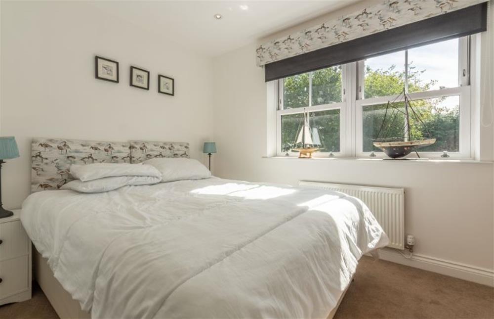 Bedroom two has a king-size zip-and-link bed at Driftwood Cottage, Brancaster near Kings Lynn
