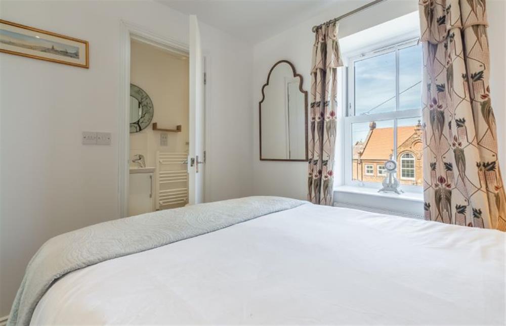 The master bedroom has an en-suite shower room at Driftwood Cottage, Brancaster near Kings Lynn