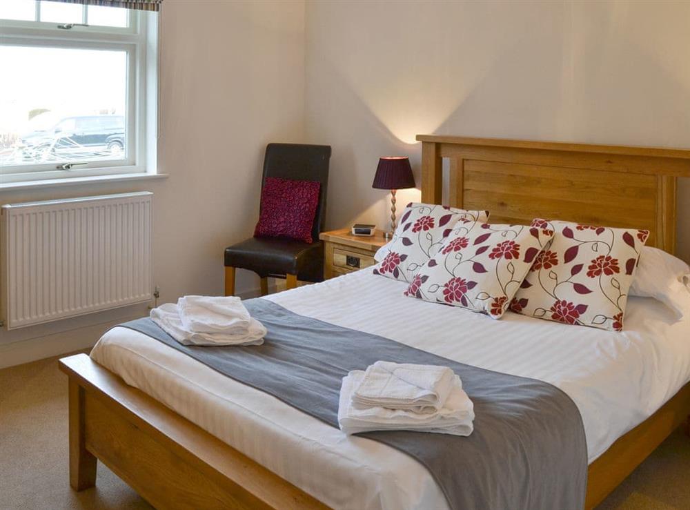 Comfortable double bedroom at Driftwood Cottage in Newton-by-the-Sea, near Alnwick, Northumberland