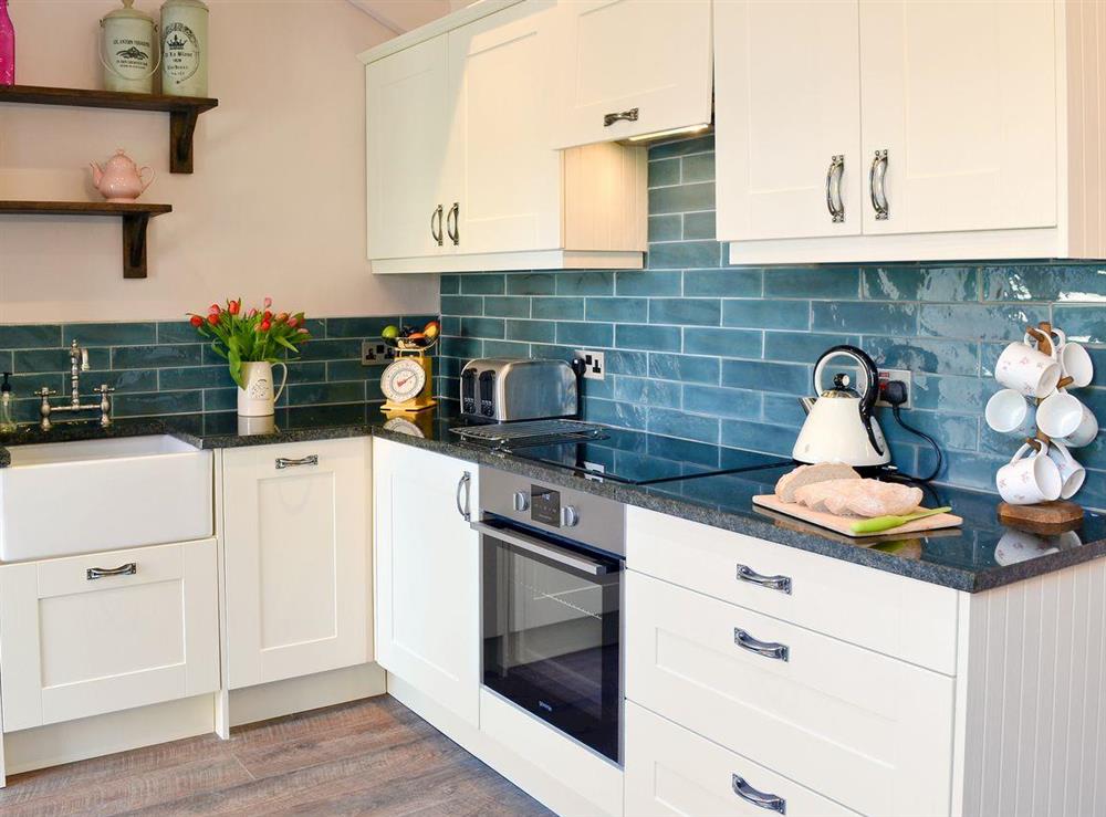 Well presented and equipped kitchen at Driftwood Cottage in Seahouses, Northumberland