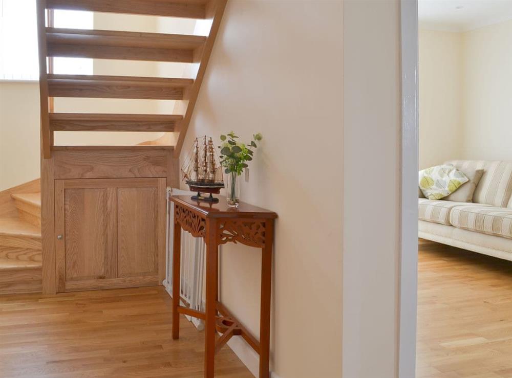 Airy hallway with open tread staircase at Driftwood in Port Isaac, Cornwall