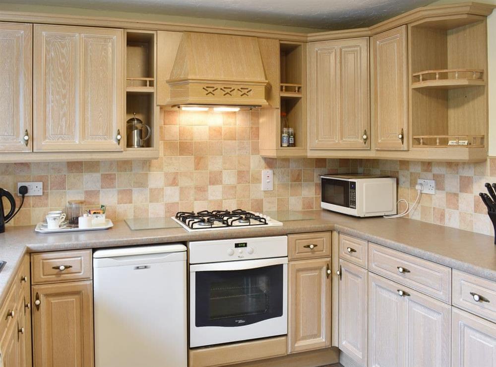 Well-equipped fitted kitchen at Drumlins Cottage in Endmoor, near Kendal, Cumbria