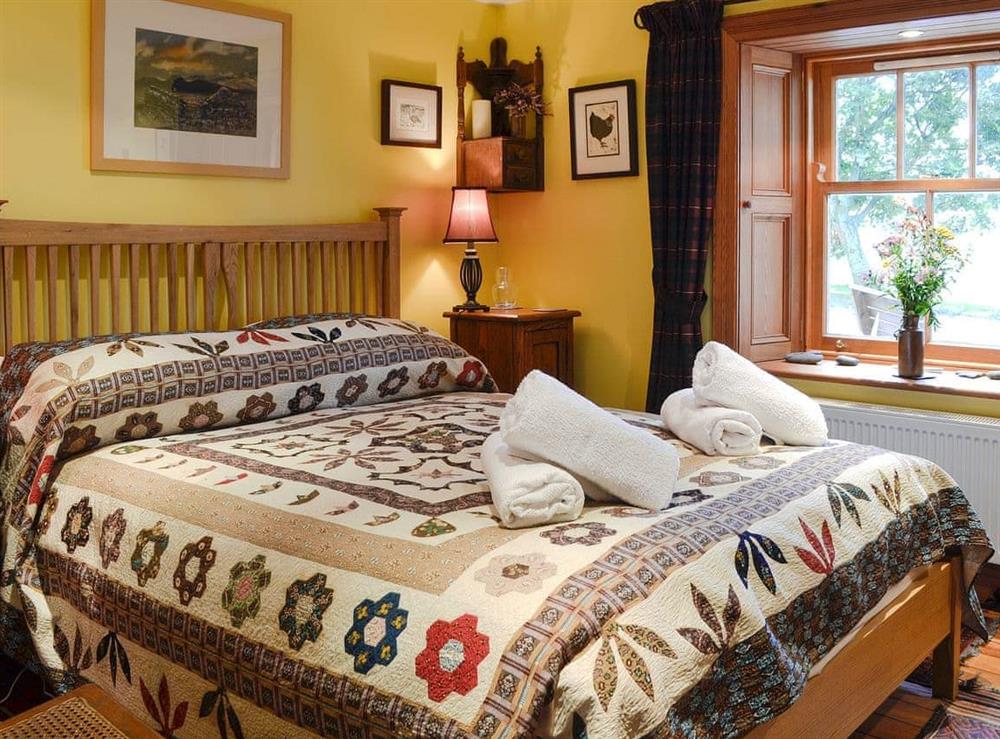 Tastefully furnished bedroom with double bed at Drumniall Cottage in Dinnet, near Aboyne, Aberdeenshire