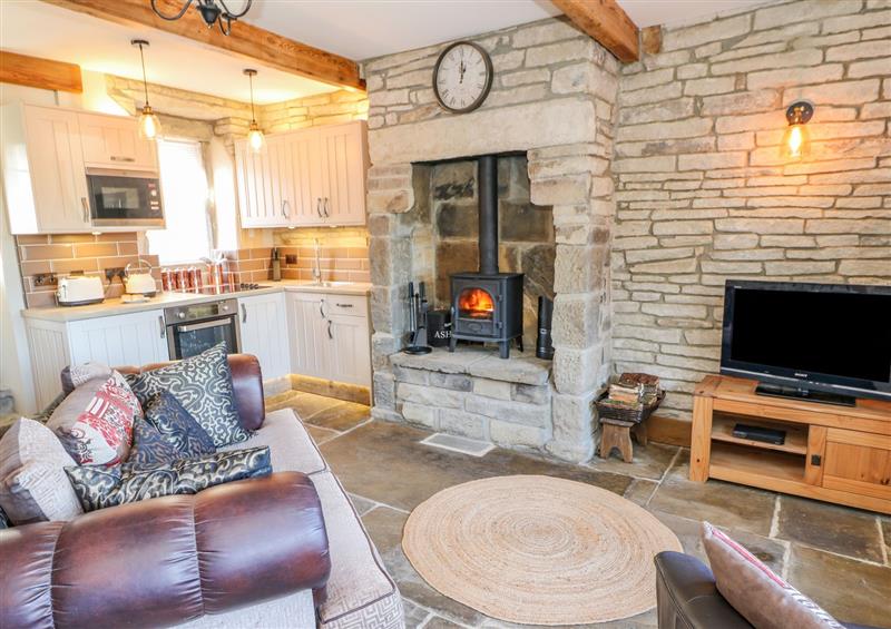 Relax in the living area at Ducking Well Cottage, Haworth