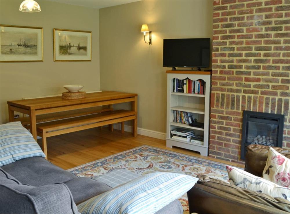 Spacious living/dining room with French doors leading to courtyard at Dudrich Cottage in St Margaret’s-at-Cliffe, Kent