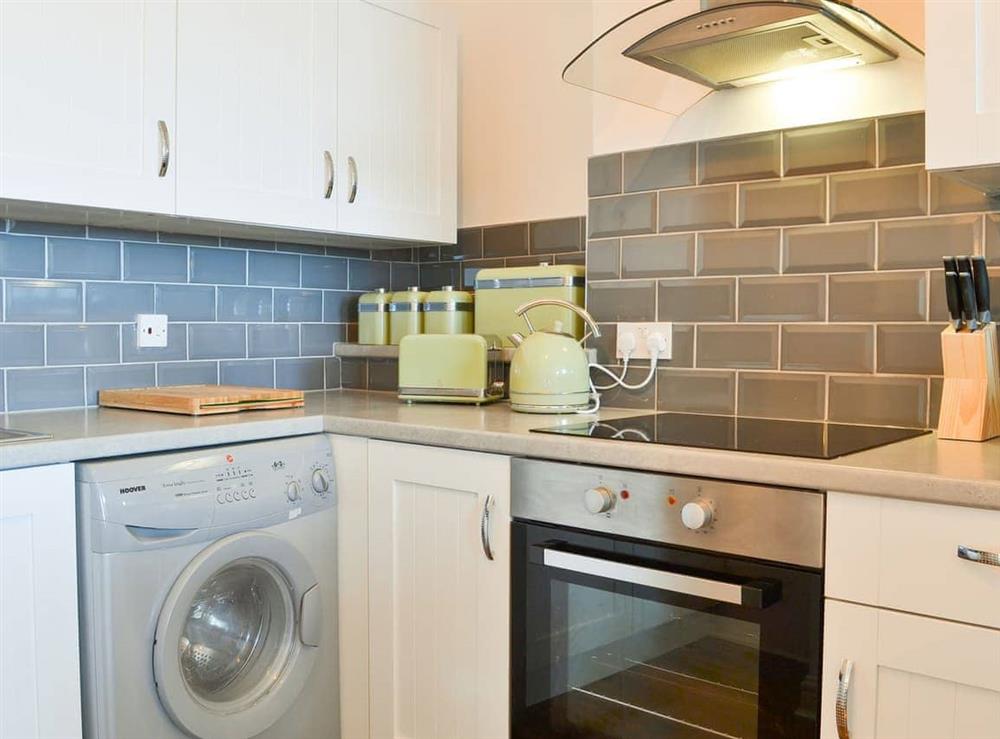 Fully equipped kitchen with laundry facilities at Duncan Square in Whitehaven, Cumbria