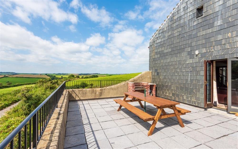 The fab balcony, with brick built barbecue and picnic bench-NOTHING ELSE SHOULD BE LEFT OUT DUE TO THE EXPOSED LOCATION at Duncombe Barn in Sherford