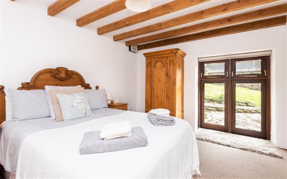 The ground floor bedroom double bed at Duncombe Barn in Sherford