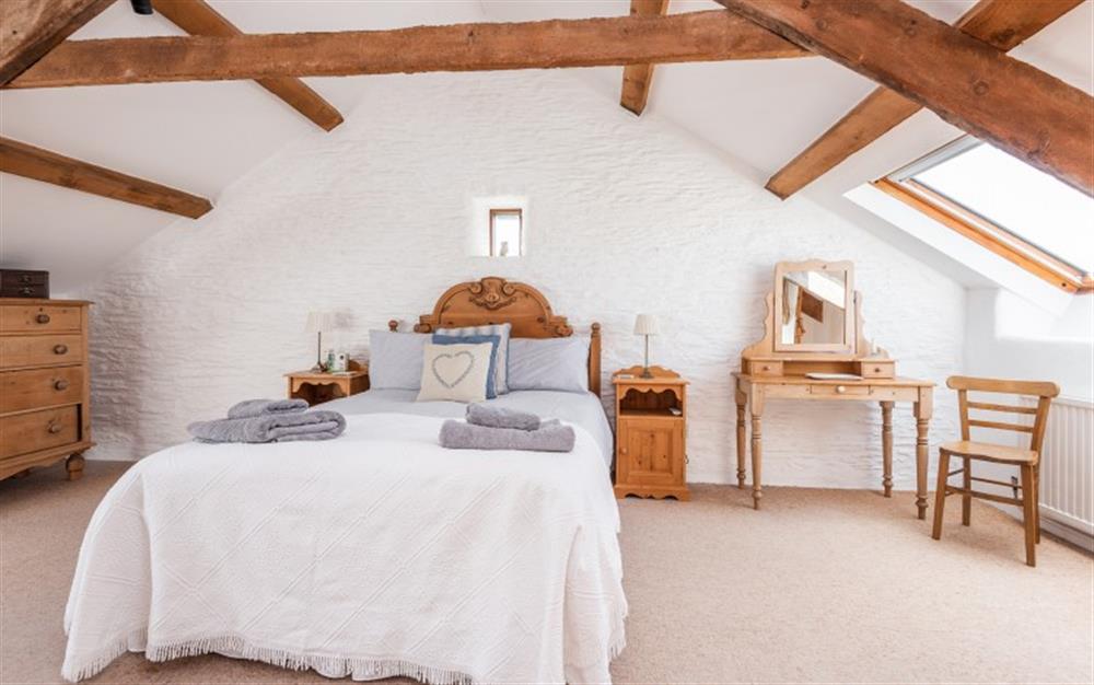 The master bedroom up in the eaves at Duncombe Barn in Sherford