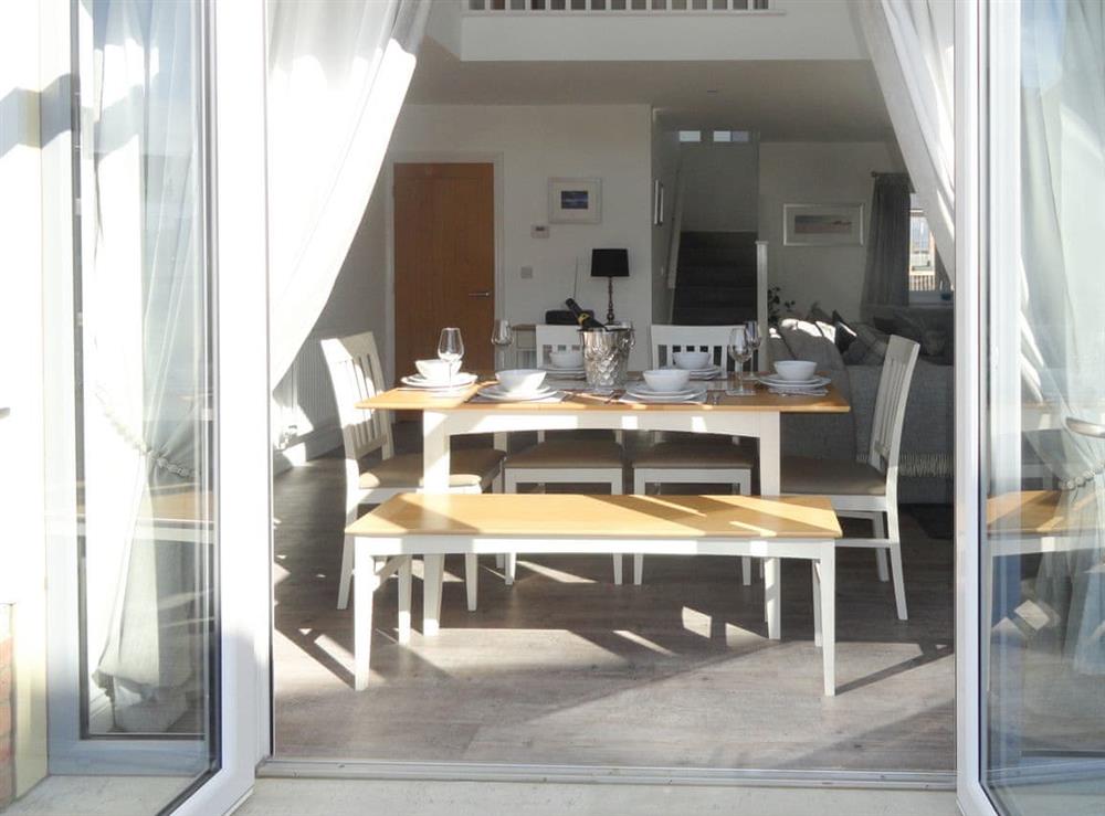 Stunning dining area with French doors to patio at Dune View in Beadnell, near Alnwick, Northumberland