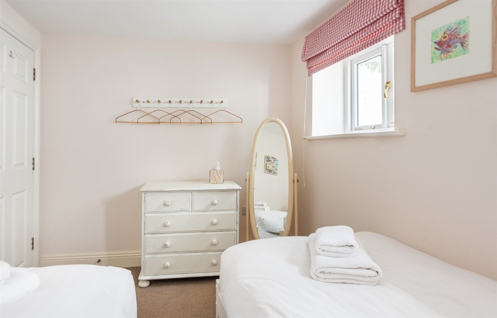 This is a bedroom at Dunedin Cottage in Dittisham