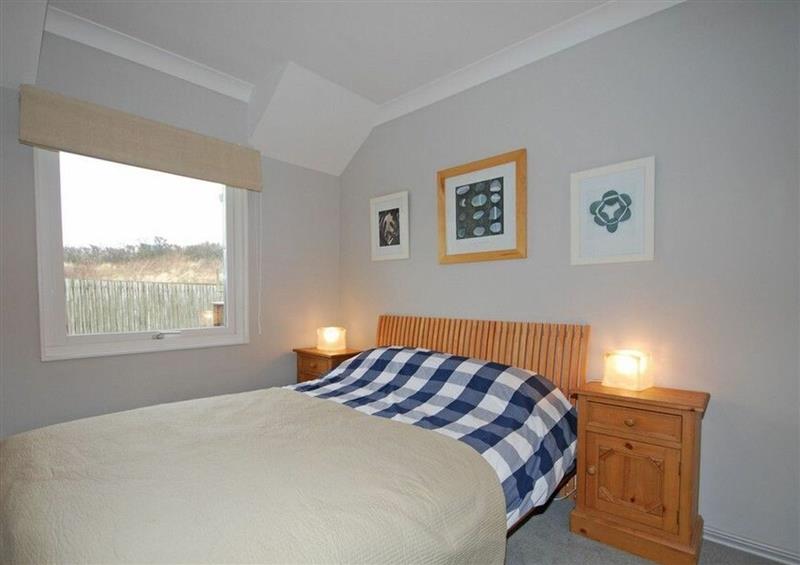 A bedroom in Dunes Cottage at Dunes Cottage, Beadnell