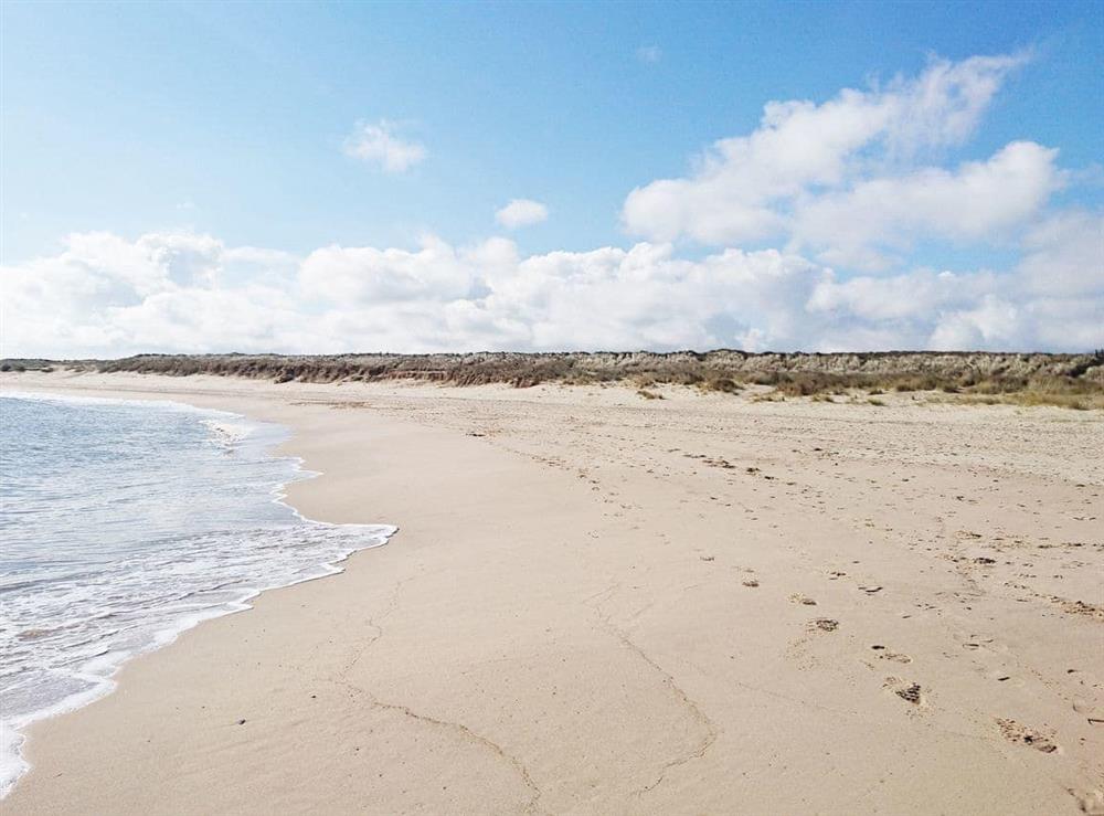 The wide golden sands are ideal for a long walk with nearby dunes for exploring at Duneside in Sea Palling, Norfolk