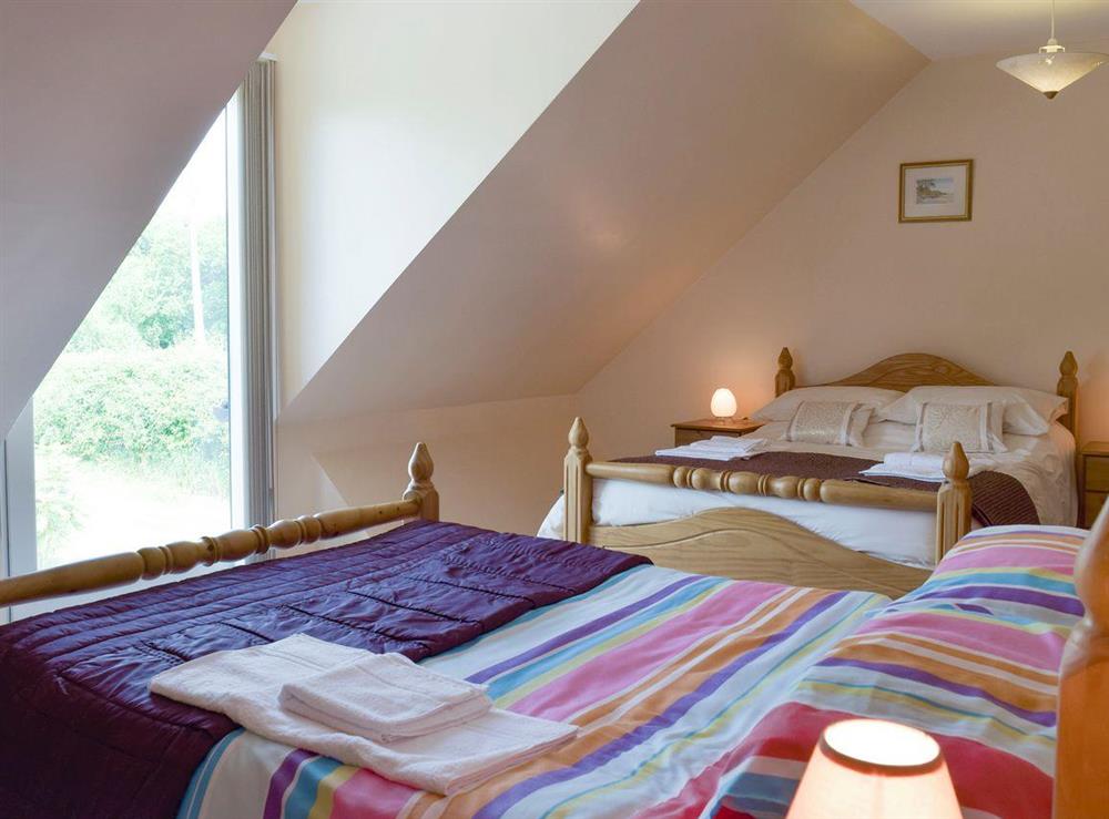 Good sized bedroom with twin double beds at Dunns Meadow in Llanrhidian, near Swansea, West Glamorgan