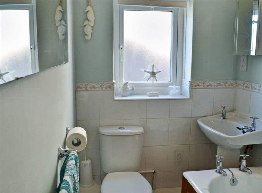 Bathroom with shower over bath at Dunstanbrough View in Beadnell, Northumberland