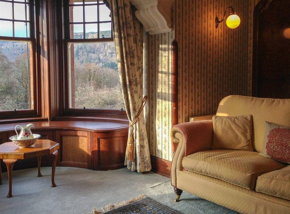 Double bedroom with feature fireplace and river views (photo 2) at Dunvarlich House in Aberfeldy, Perthshire., Great Britain