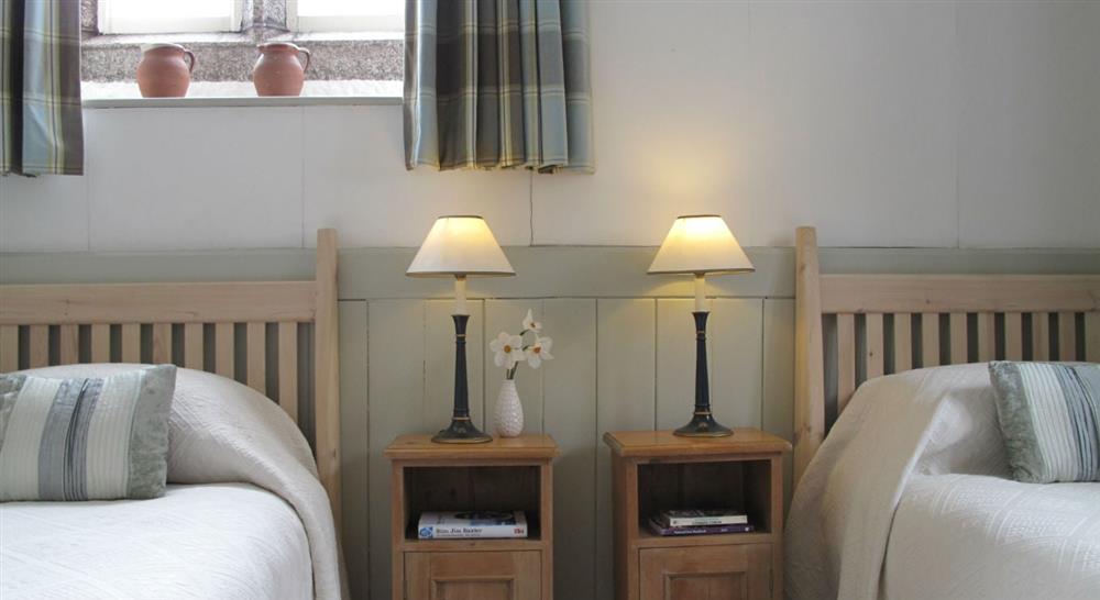 The twin bedroom at Durgan Old School House in Falmouth, Cornwall