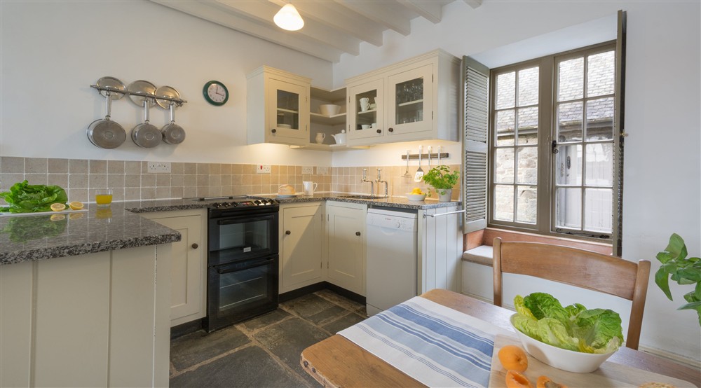The kitchen and dining area of Durgan Quay Cottage, Cornwall at Durgan Quay Cottage in Falmouth, Cornwall