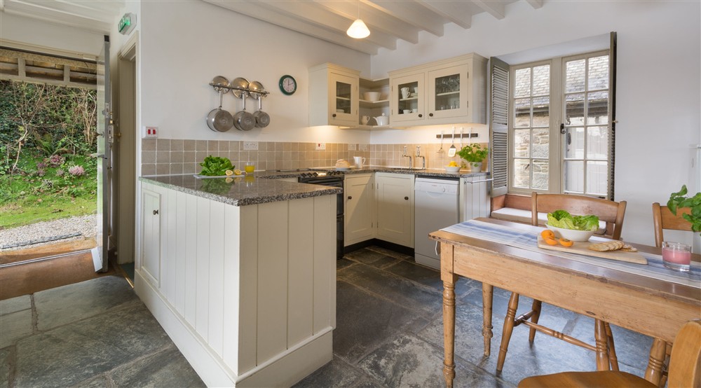 The kitchen and dining area at Durgan Quay Cottage in Falmouth, Cornwall