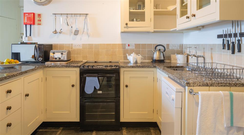 The open plan kitchen at Durgan Quay Cottage in Falmouth, Cornwall