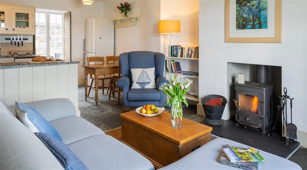 The open plan sitting and dining room at Durgan Quay Cottage in Falmouth, Cornwall