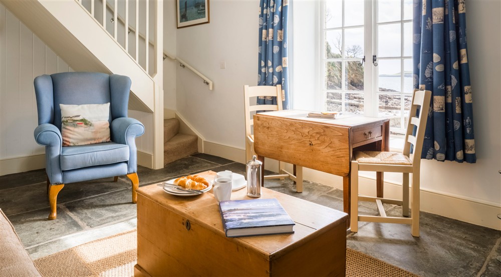 The sitting and dining room at Durgan Quay Cottage in Falmouth, Cornwall