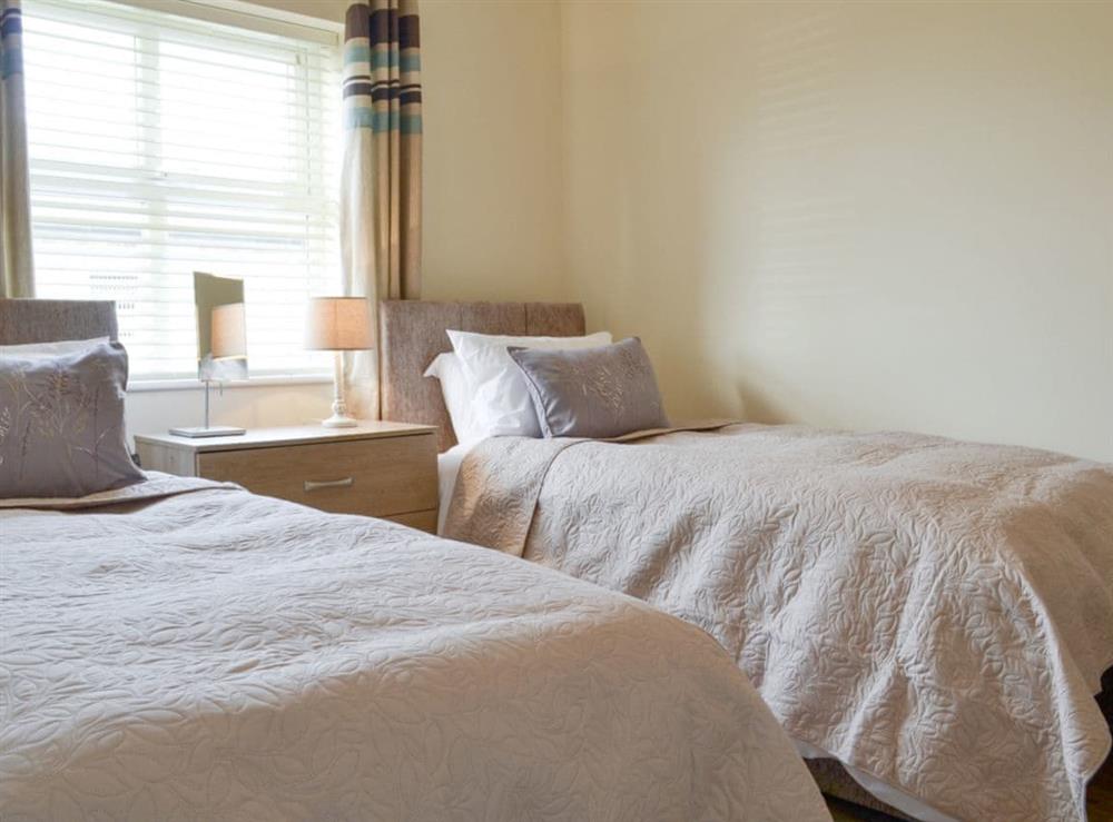 Typical light and airy twin bedroom at Bramble Cottage, 