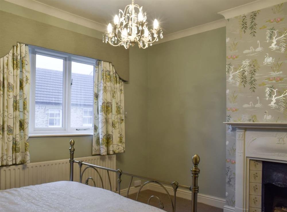 Double bedroom with heritage fireplace at Durham House in Sedgefield, near Durham, Cleveland