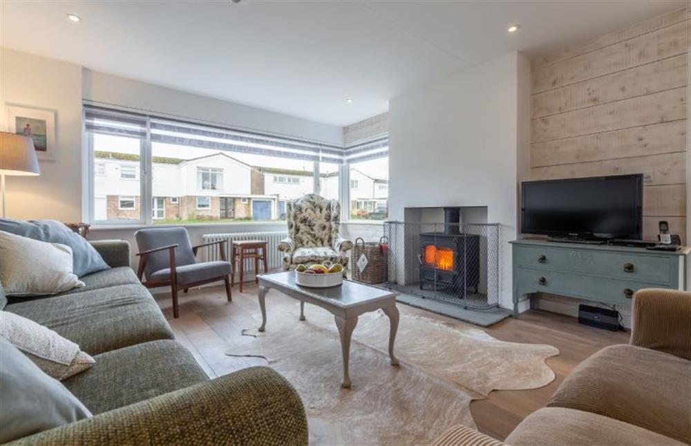 Ground floor: Comfortable sitting area with wood burning stove at Dushi, Brancaster Staithe near Kings Lynn