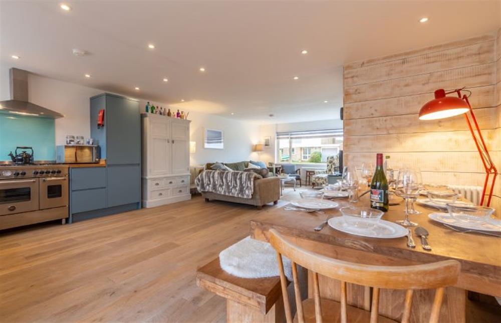 Ground floor: Dining area view to the kitchen and sitting area at Dushi, Brancaster Staithe near Kings Lynn