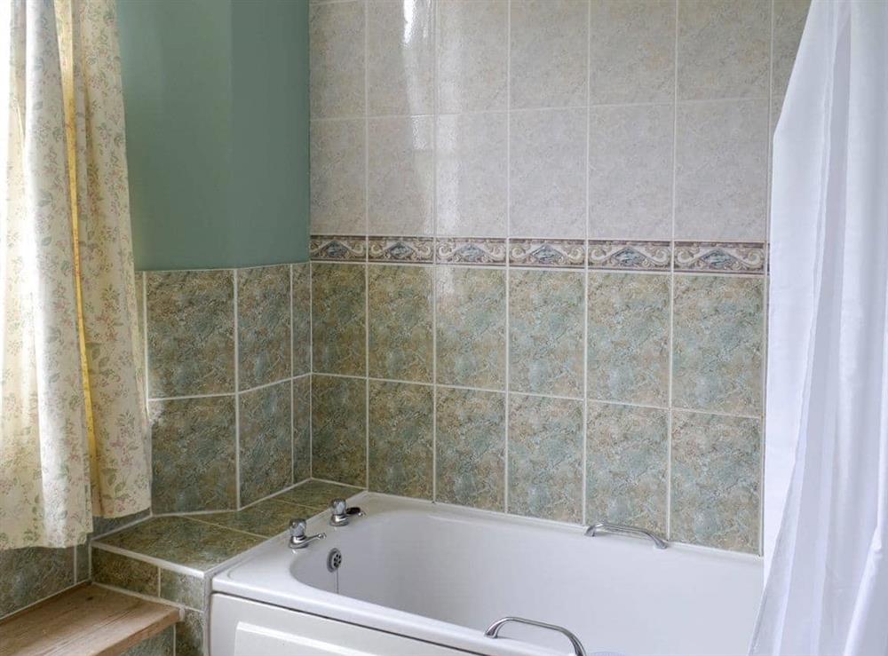 Bathroom with shower over bath at Duvale Priory in Bampton, near Tiverton, Devon