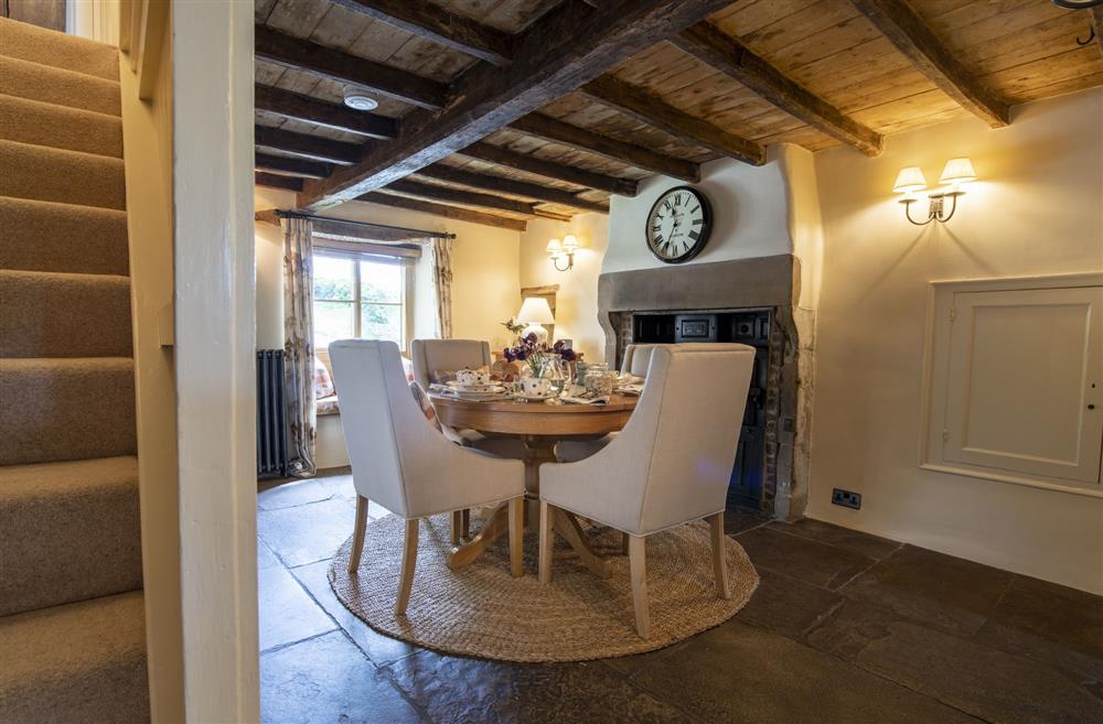 Dining room featuring the original Yorkshire flagstone floor at Duxey Cottage, Nr Masham, Ripon