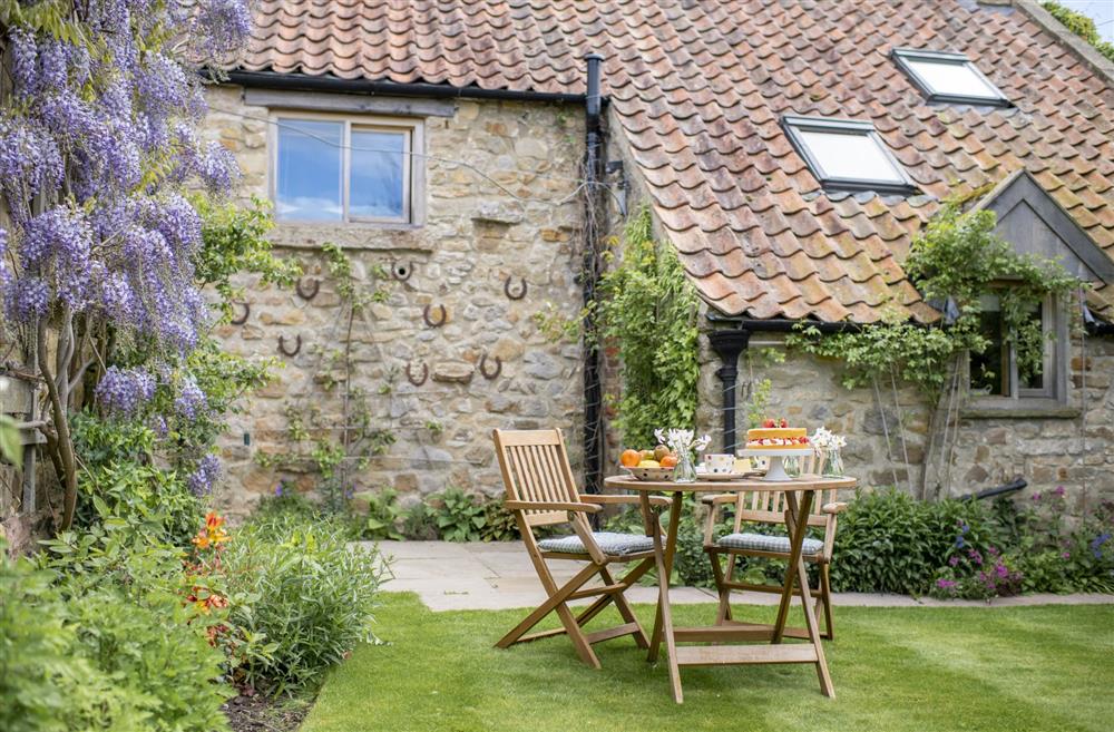 Rear garden laid to lawn, perfect for tea and cake  at Duxey Cottage, Nr Masham, Ripon