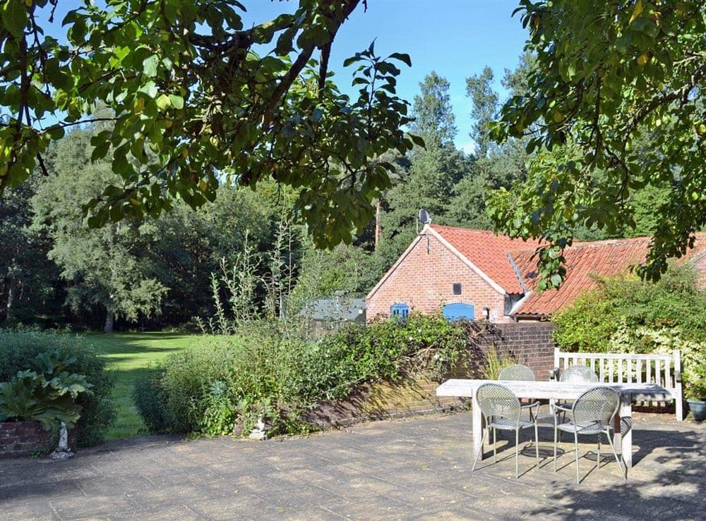 The cottage benefits from a lovely large garden and large seating terrace at Dyes Cottage in Hindolveston, near Holt, Norfolk